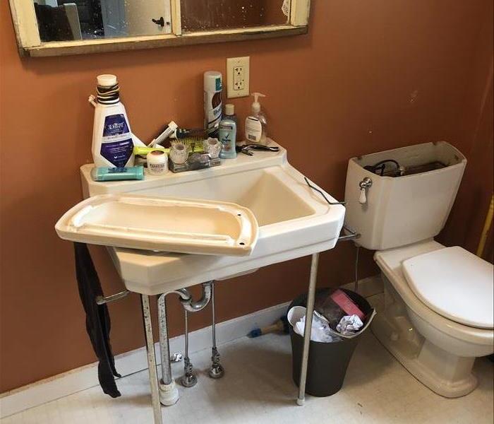 bathroom water damage, orange wall